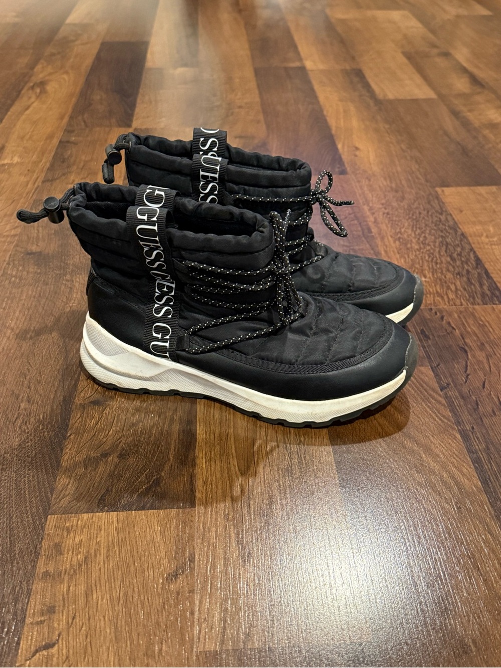 Guess women’s “Chilly” black quilted winter boots (size 7)